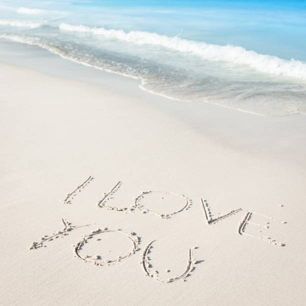 istock I love you text on sand beach 166146447