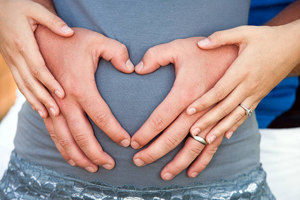 istock Couple hands making heart symbol. 166147119