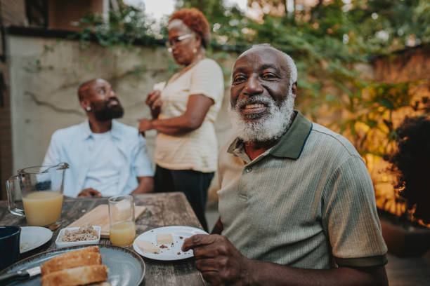 istock Portrait senior man at breakfast table 1661475926
