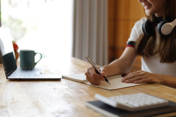 istock Woman studying online seminar on internet laptop. 1661476853