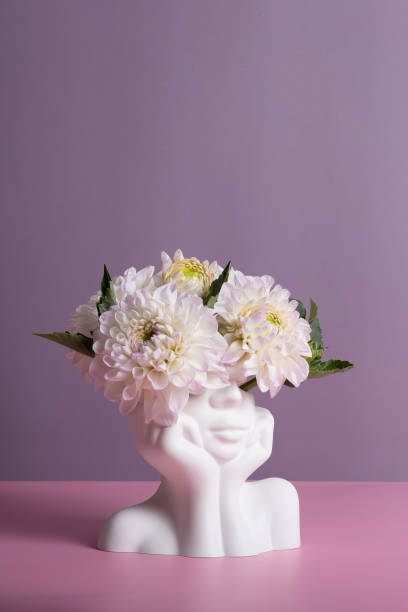 istock Plaster head with flowers on a colored background. Mental health concept. Copy space 1661477902