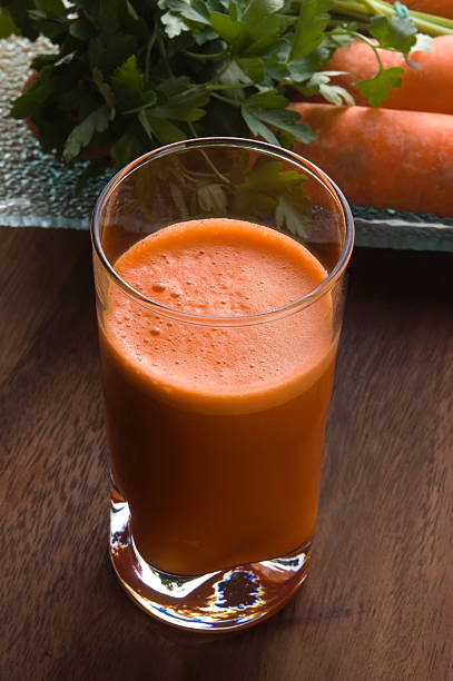 istock carrot juice on a wooden background 166148227