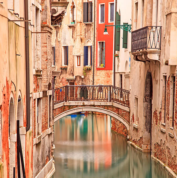 istock Venice, Bridge on water canal and traditional architecture 166148269