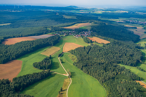 The landscape of Franconian Switzerland near Pottenstein/Germany seen from a small plane