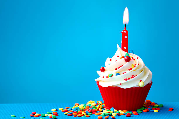 Birthday cupcake Cupcake decorated with a single candle birthday cake photos stock pictures, royalty-free photos & images