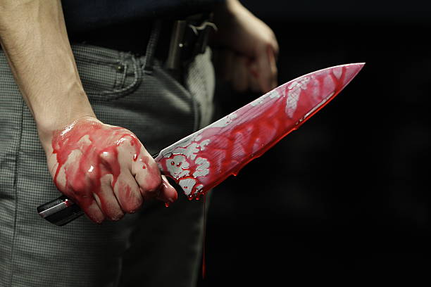 istock Close up of knife with blood dripping 166149765