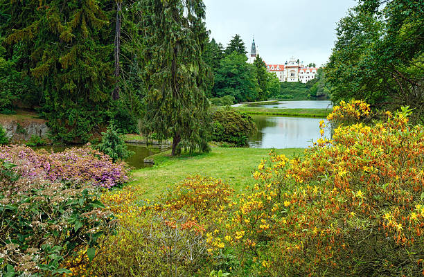 Pruhonice Castle (Prague, Czech) park summer view with lakes and blossoming bush. Was established in the 12th century.