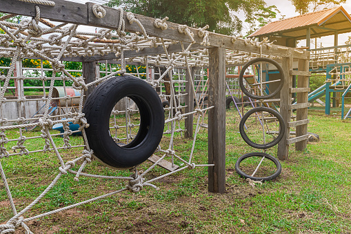An old tire swing hangs on the playground. Enjoy healthy holiday activities.