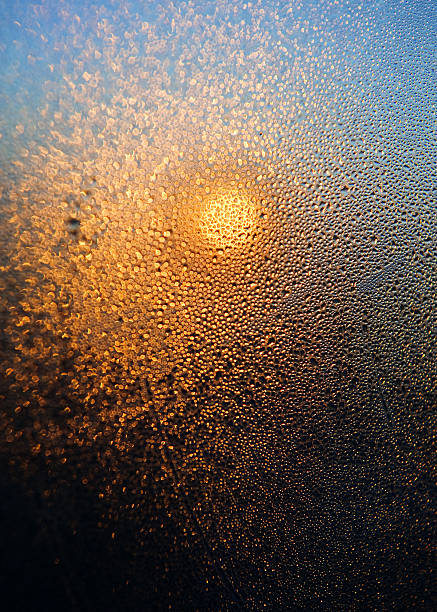istock Water drops in sun beams on the window surface 166151496