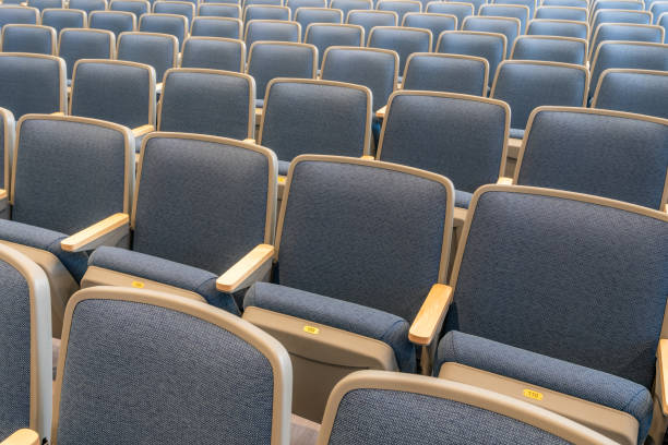 istock Close up image of empty gray and blue theater, auditorium seats, chairs. 1661520249