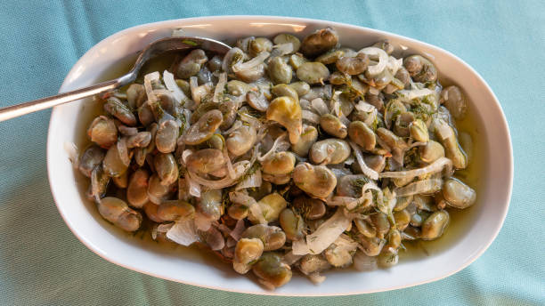istock Fresh broad bean salad with olive oil, broad beans, onion and dill 1661523892