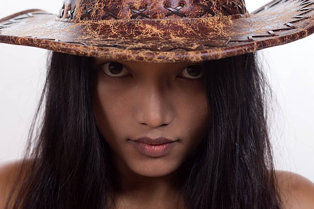 fashion shoot of asia young women sitting on wood terrace in park