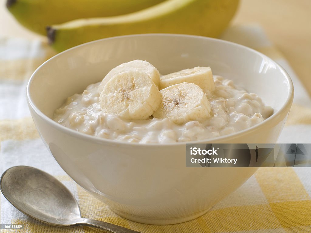 porridge A bowl of porridge with bananas, selective focus Child Stock Photo