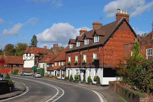 Cottages at Chiddingfold. Surrey. England Tiled and brick cottages on main road at Chiddingfold. Surrey. England surrey england stock pictures, royalty-free photos & images