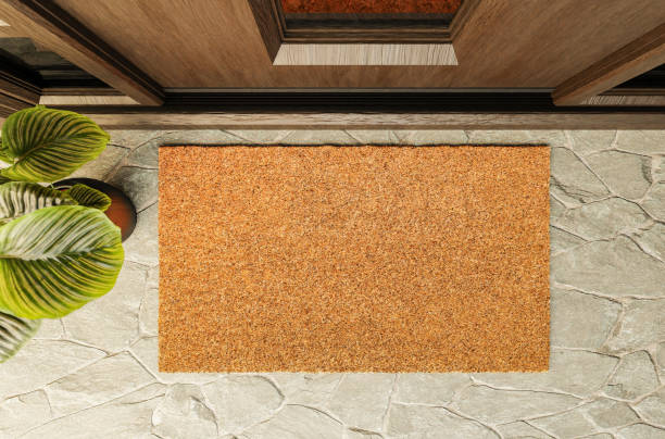 Overhead of blank doormat on the porch at the front door. stock photo