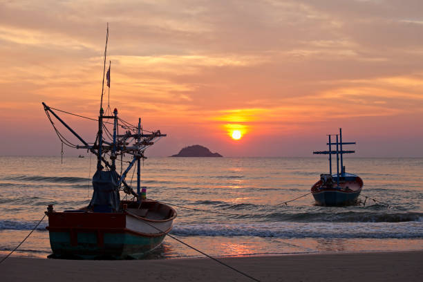 Free picture: Silhouette of a fishing boat on sea at sunrise