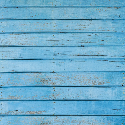 Old weathered blue wooden board background. Composite image.