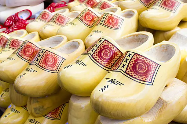 Photo of Dutch traditional wooden shoes with ornament, clogs, symbol of t