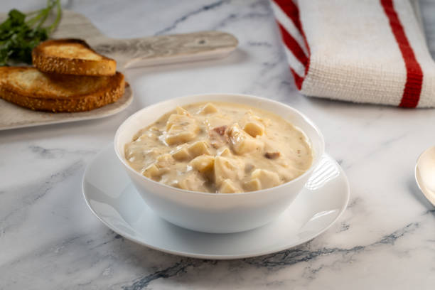 istock loaded potato soup and bread on white table 1661571926