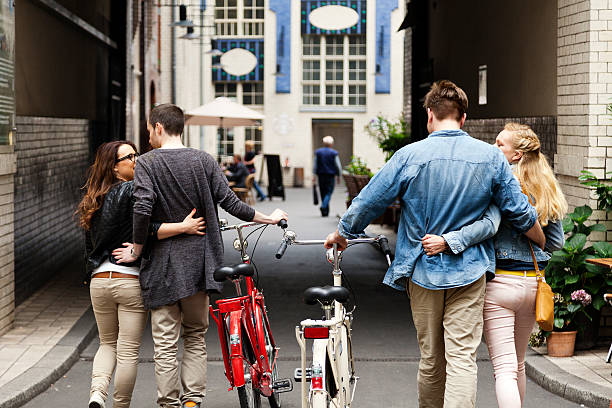 istock Two Young Couples Leisure Alley Walk 166157493