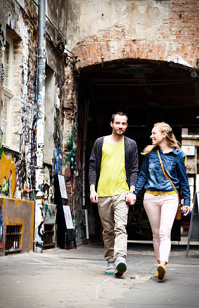 istock Young Couple Walking in Alley 166158070