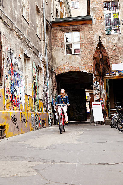 istock Riding on Bicycle in Colorful Alley 166158071