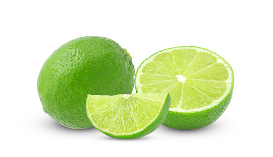 Whole and slices of lime fruit isolated on white background
