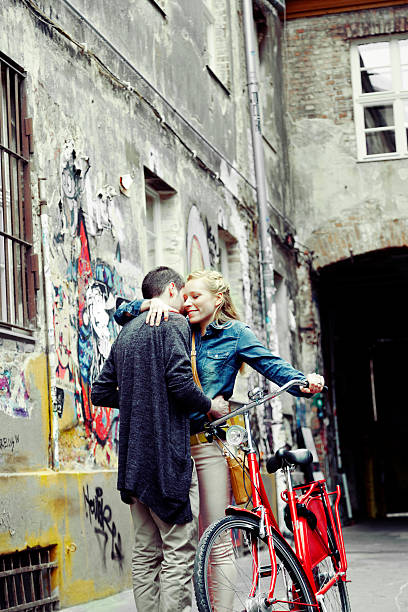 istock Young Couple Hugging in Alley 166158353