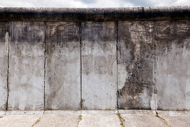 East-West Berlin Original Wall Section View of a section of the original east-west Berlin wall, part of the Berlin Wall Memorial at Bernauer strasse, east Berlin, Germany. east berlin photos stock pictures, royalty-free photos & images