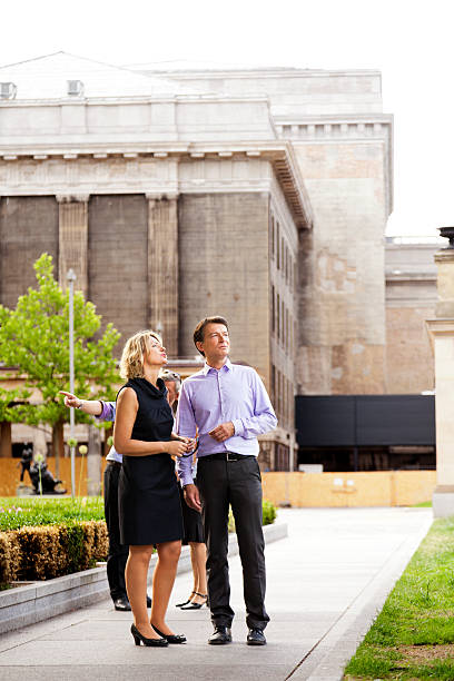 istock Four Elegant People Walking in Urban Garden 166159348