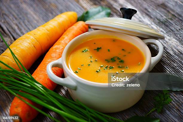 Carrot Soup In A White Bowl With Lid And Carrots On The Side Stock Photo - Download Image Now