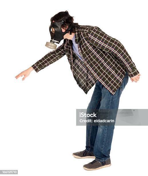 Isolated Man Wearing Gas Mask And Reaching Stock Photo - Download Image Now - Gas Mask, Profile View, 30-34 Years