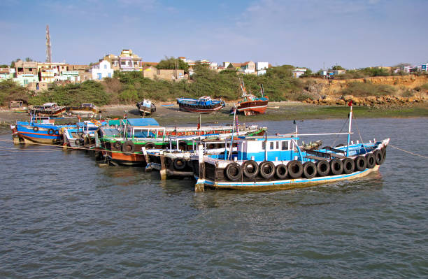colorful fishing boats parked in beit dwarka, in gujrat, india - horizontal landscape coastline gujarat imagens e fotografias de stock