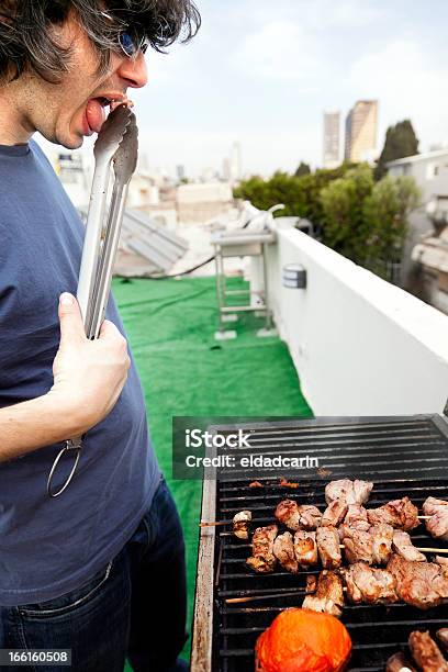 Munching Off The Grill Stock Photo - Download Image Now - 30-34 Years, 30-39 Years, Adult