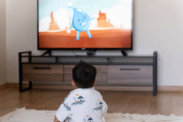 istock Little boy watching cartoons. 1661619543