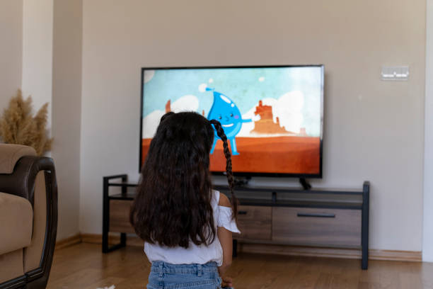 istock Girl watching cartoons. 1661619976