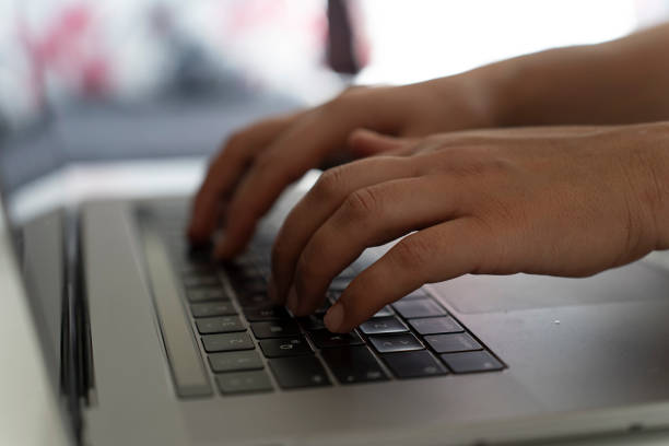 istock A woman using a smartphone and a laptop. 1661622135