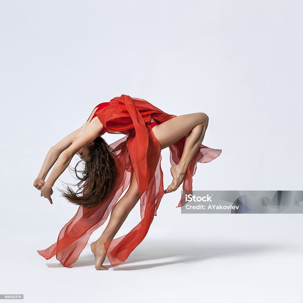 the dancer young beautiful yoga posing on a gray studio background Ballet Stock Photo