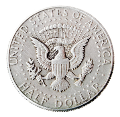 Frontal view of the reverse(tails) side of a silver half Dollar minted in 1964. Depicted is the US presidential seal.