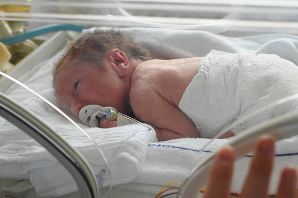 istock Newborn baby in incubator 166162678