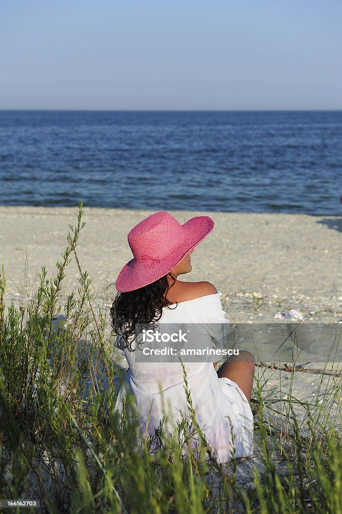 Romantic girl Young women enjoying the sea view in summer evening 30-39 Years Stock Photo