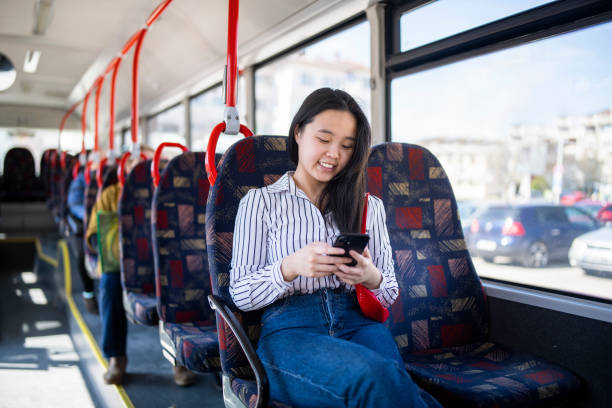 istock Young woman using technology while riding in the public transport. 1661657006