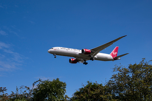 Virgin Atlantic Dreamliner landing at London Heathrow Airport on a beautiful sunny day.