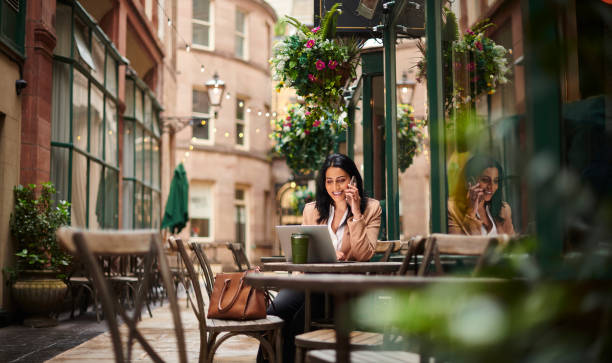 business coffee stop young businesswoman stops for a coffee liverpool one stock pictures, royalty-free photos & images