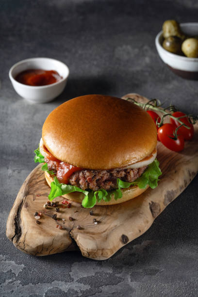 istock Beef burger on wooden plate 1661684463