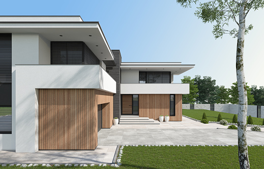 Modern two floors white villa with wooden vertical panels. Luxury exterior concept with beautiful garden. Summer time.