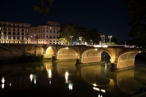 Night view of Castel Sant'Angelo and Ponte Sant'Angelo over the Tiber River in Rome, Italy