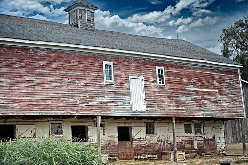 A vintage barn showing all the history it has expeienced over time...