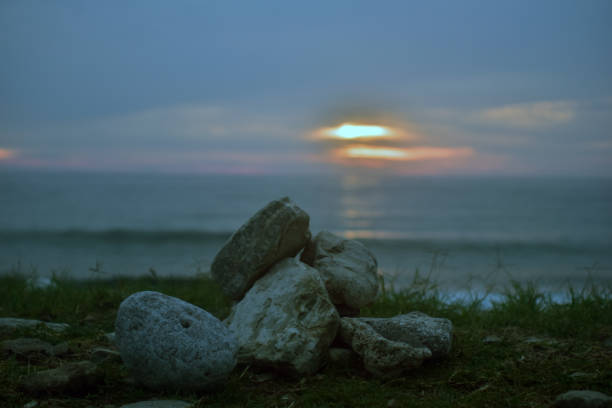 Sunset over sea on a cloudy day. Nature background landscape photo.