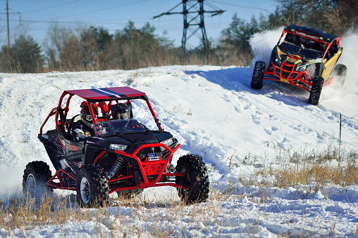 ATV, UTV, buggy, 4x4 off-road vehicle racing in the snow. Extreme, adrenalin
